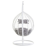 Angled view of the white rattan hanging chair, plain background