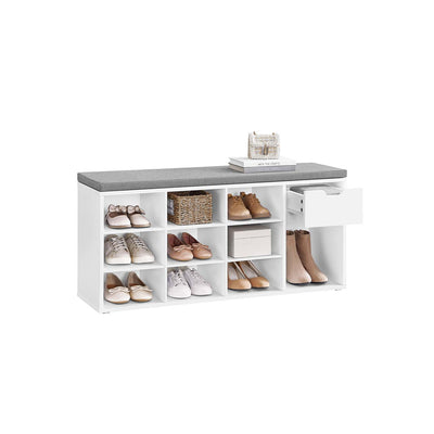White shoe storage bench with grey padded seat, filled with shoes across nine cubbies and a boot space