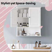 Open bathroom cabinet doors showing toiletries and toilet roll storage inside