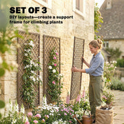 Woman positioning a wicker trellis panel against a stone wall to create a custom DIY layout