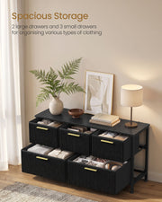 Open drawers showing 2 large and 3 small storage compartments holding folded clothes and accessories
