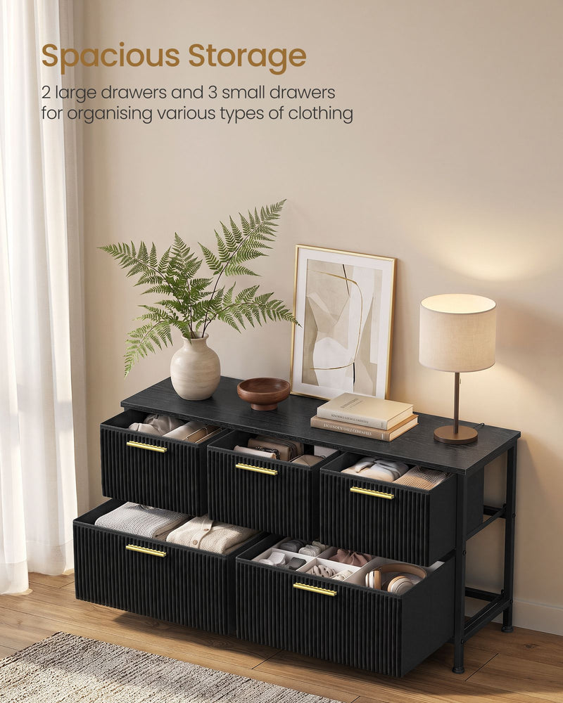 Open drawers showing 2 large and 3 small storage compartments holding folded clothes and accessories