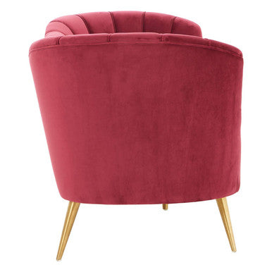 Side view of the wine velvet 3 seater sofa on a plain background