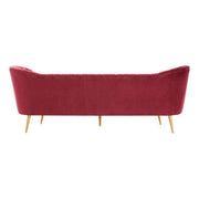 Angled view of the wine velvet sofa showing flared shoulder detail