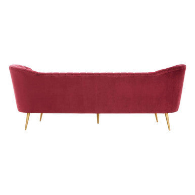 Angled view of the wine velvet sofa showing flared shoulder detail