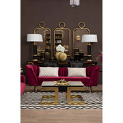 Wine velvet 3 seater sofa shown as a living room centrepiece