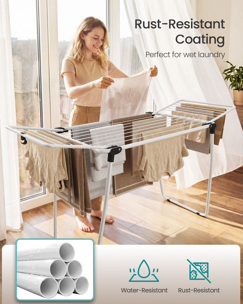 Woman hanging wet laundry on the airer beside a bright window with rust-resistant coating callout