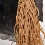 Close-up of the straw broomstick bristles held by the Homcom witch with broomstick animatronic
