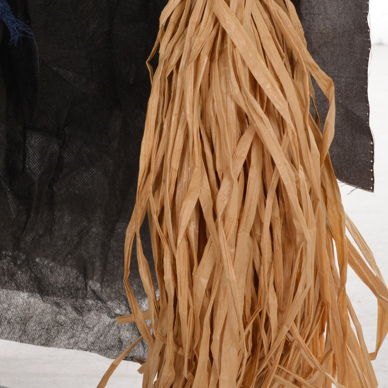 Close-up of the straw broomstick bristles held by the Homcom witch with broomstick animatronic
