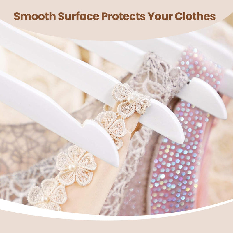 Close-up of notched hanger shoulders holding thin dress straps in place
