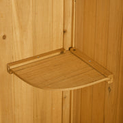 Close-up of a removable quarter-round shelf inside the natural wood shed