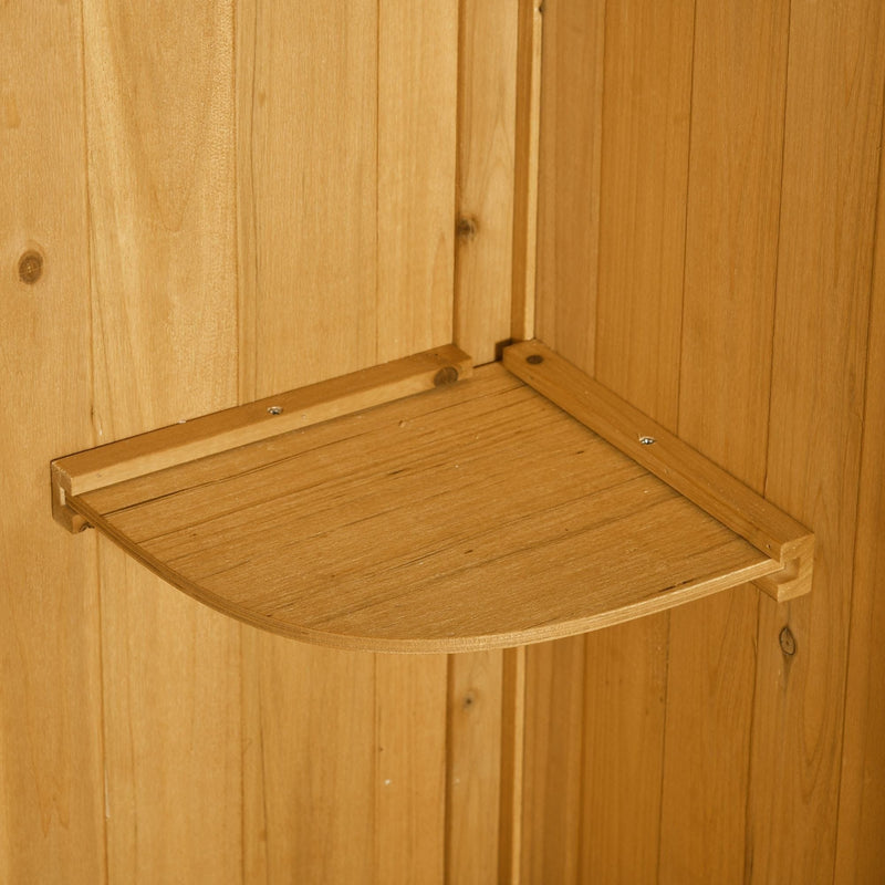 Close-up of a removable quarter-round shelf inside the natural wood shed
