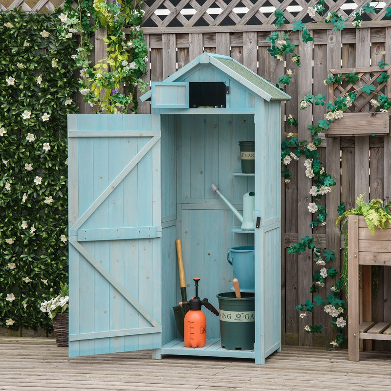 Blue sentry box shed with its door open in a garden, garden tools stored inside