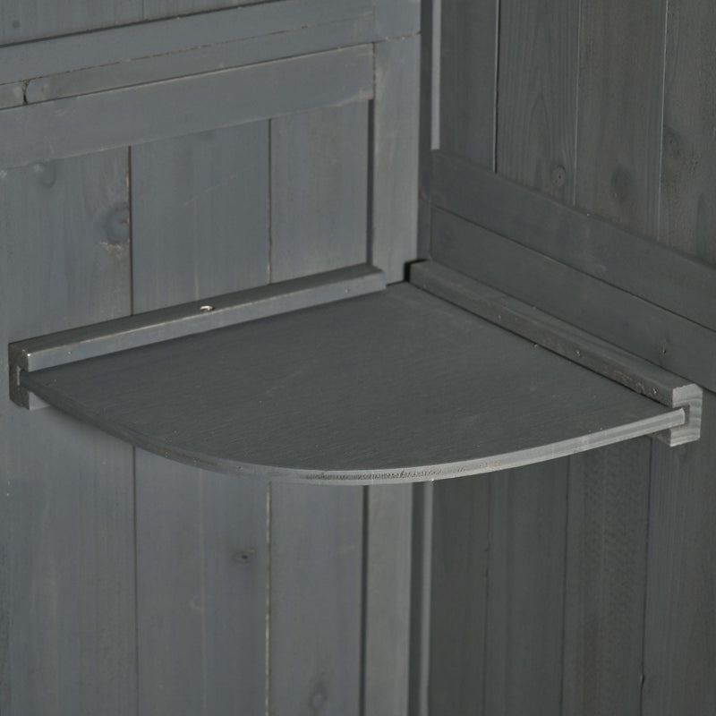Close-up of a removable quarter-round shelf inside the grey shed