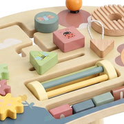 Close-up of shape pieces, bead slider and number blocks on the activity table top