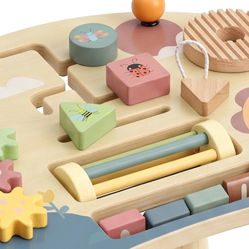 Close-up of shape pieces, bead slider and number blocks on the activity table top