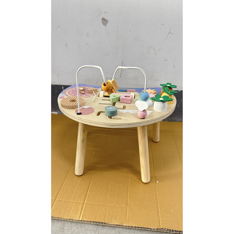 Front view of the activity table with bead maze on a cardboard floor