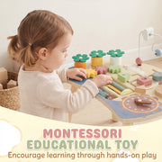 Toddler playing with the flower pieces and beads on the Montessori activity table