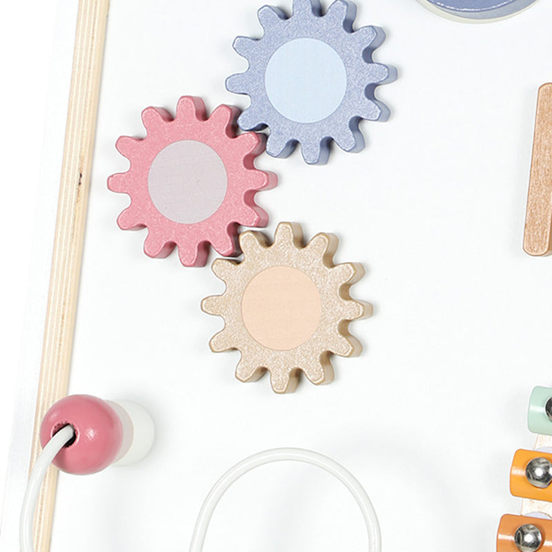 Close-up of the pastel spinning gears and bead maze on the activity panel