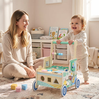 Toddler pushing the wooden baby walker while playing with their mum on a rug