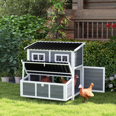 Chicken coop set up in a garden with hens standing at the open side door