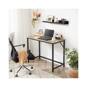 Wooden computer desk with storage shelf by Vasagle, styled in a home office setting