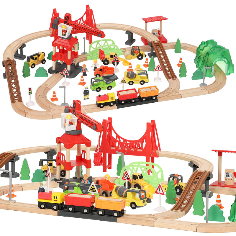 Wooden construction train set with red crane, bridge, tunnel and vehicles on a white background