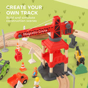 Close-up of the magnetic crane, construction workers and traffic cones on the track