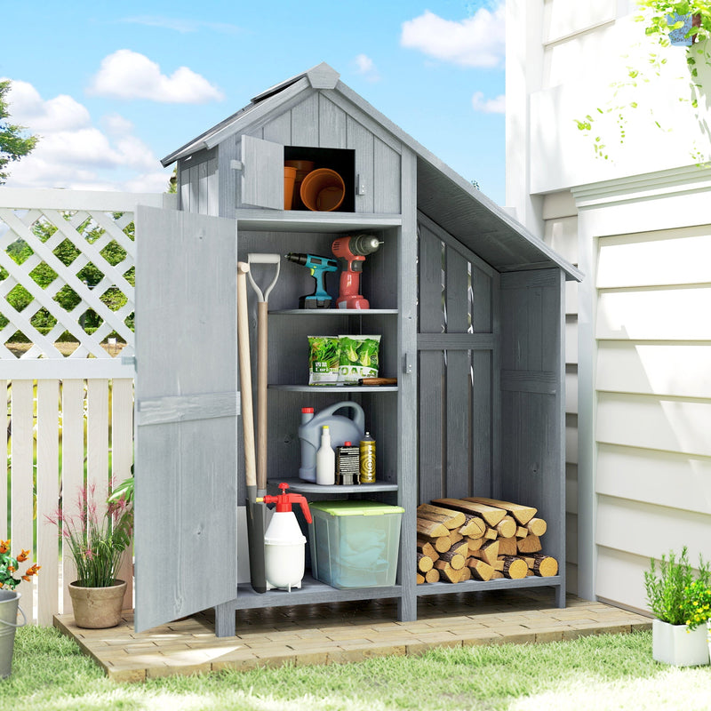 Garden shed with the door open showing tools on three shelves and logs stacked below