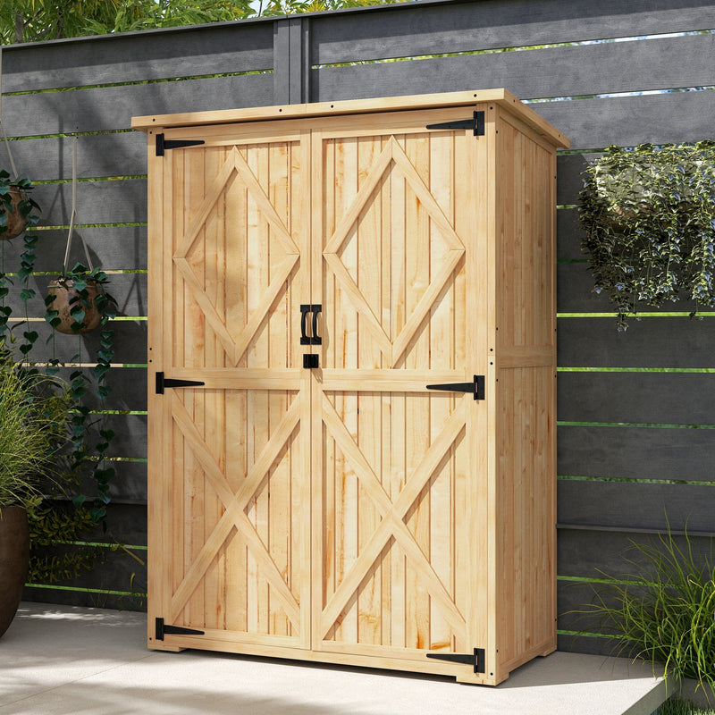 Natural wooden shed closed against a dark garden fence with trailing greenery beside it