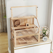 Natural wood hamster cage with the top lid open on a sideboard