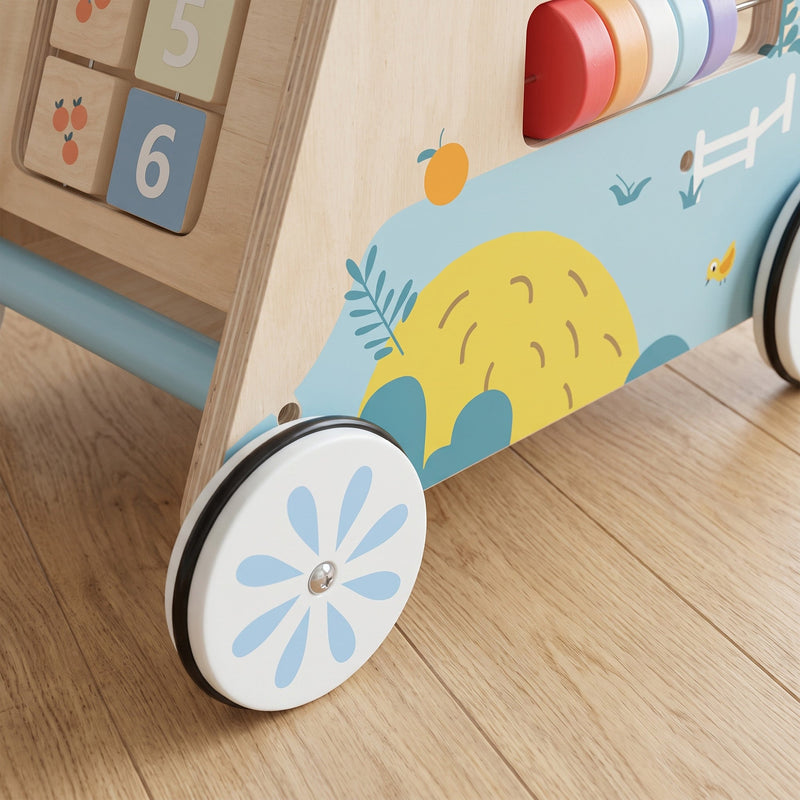 Close-up of a rubber-trimmed wheel on the wooden baby walker