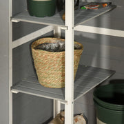 Inside the grey shed with a basket and plant pot on the shelves