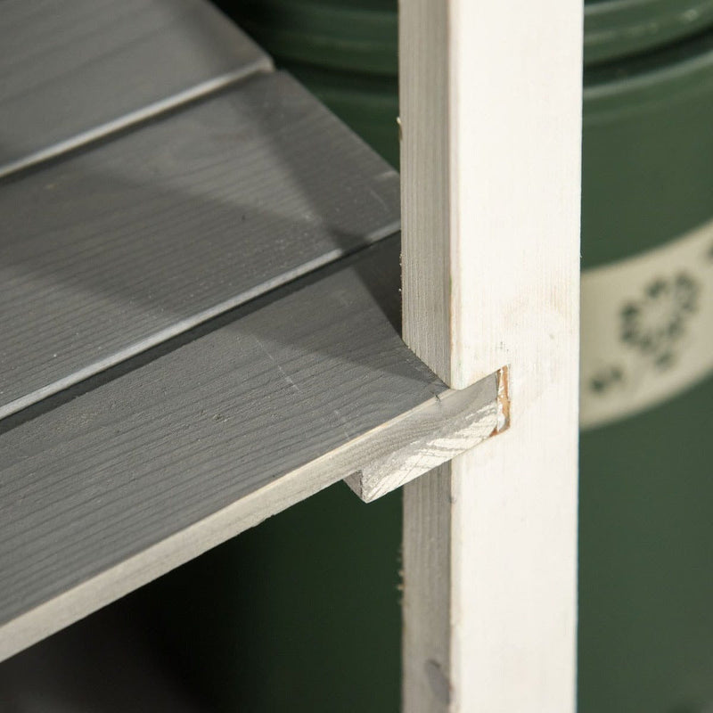 Angled view of a shelf board and the timber upright inside the grey shed