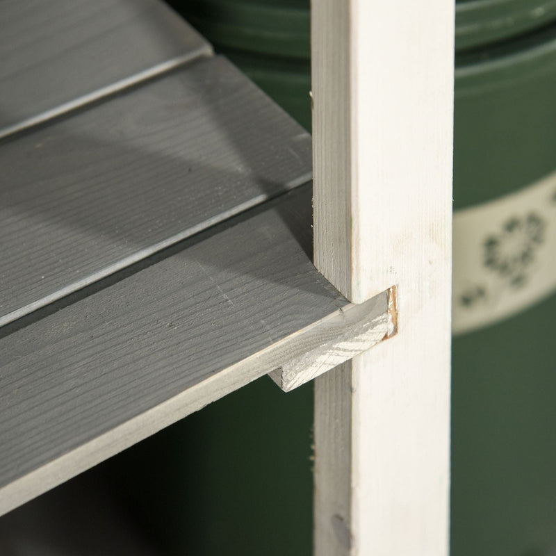 Close-up of the grey shelf boards and the white painted support post