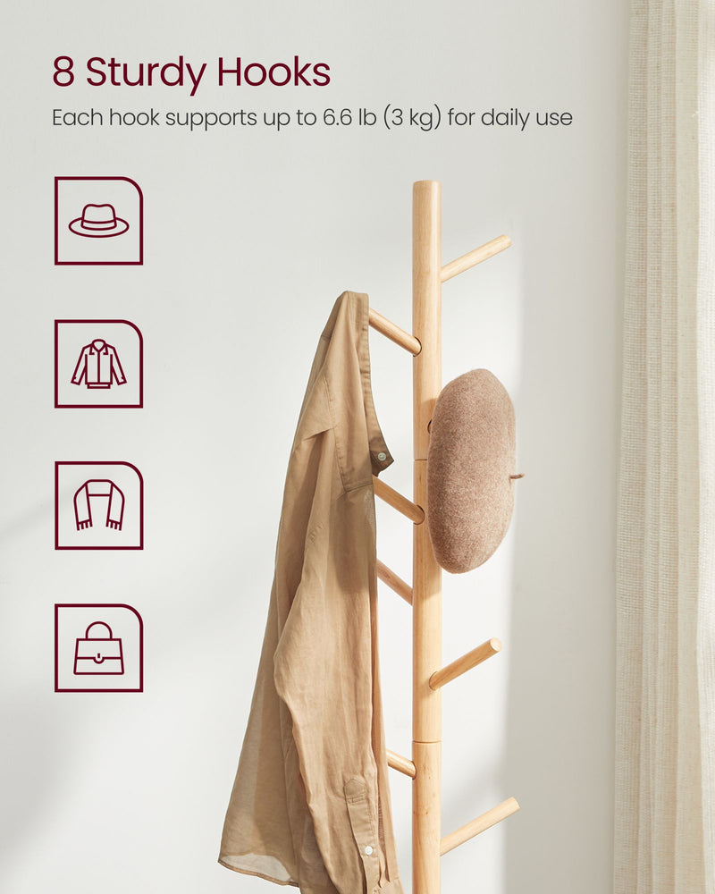 Wooden tree coat rack in a bedroom setting