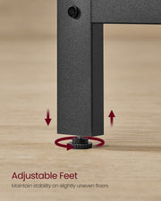 Close-up of the threaded levelling foot at the bottom of a black steel desk leg on a wooden floor