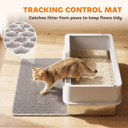 Lifestyle shot of the litter tray and mat set beside a sofa