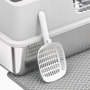 Close-up of the litter scoop and grey tracking mat