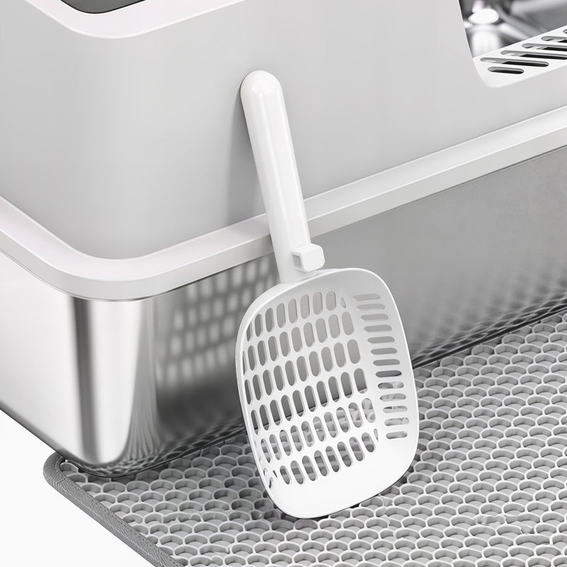 Close-up of the litter scoop and grey tracking mat