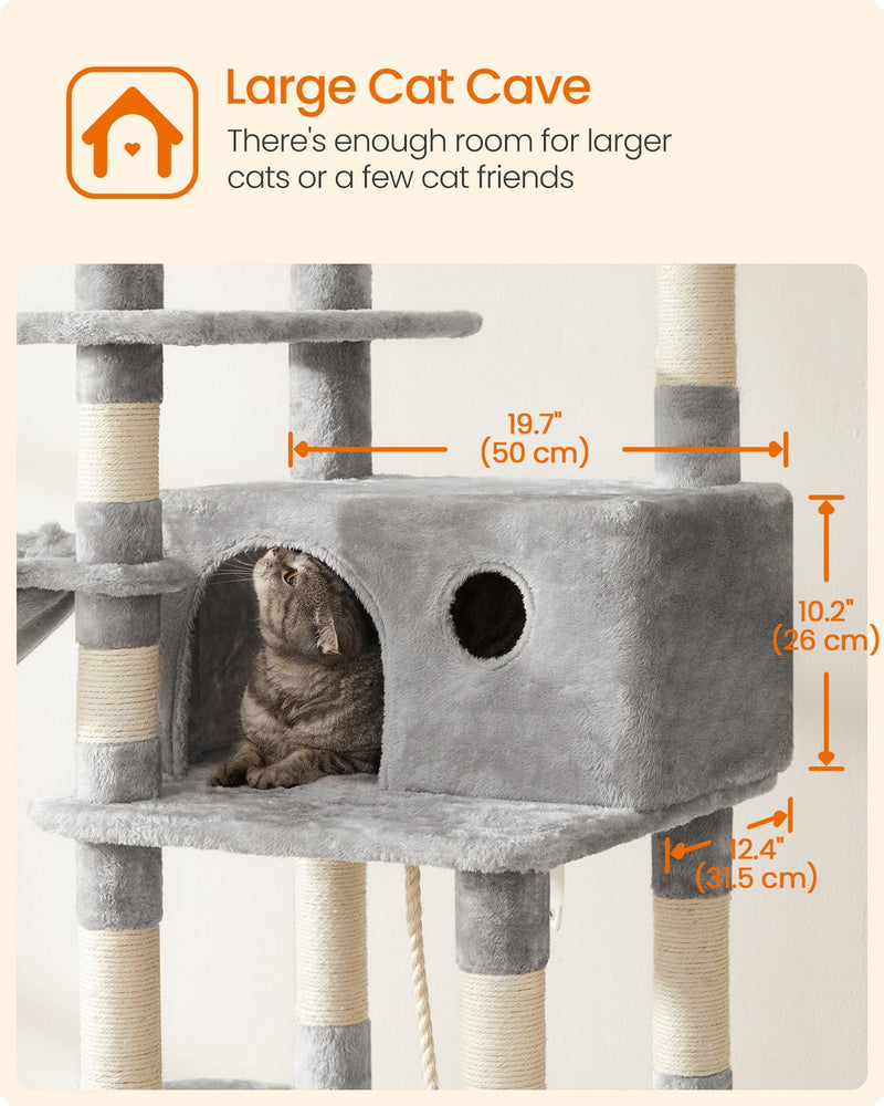 Cat sitting inside the 50 cm wide cave of the light grey cat tree