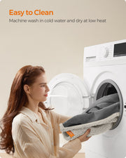 Feandrea dog blanket being loaded into a washing machine for a cold machine wash