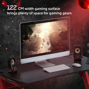 122 cm wide gaming surface holding a monitor, keyboard and speakers