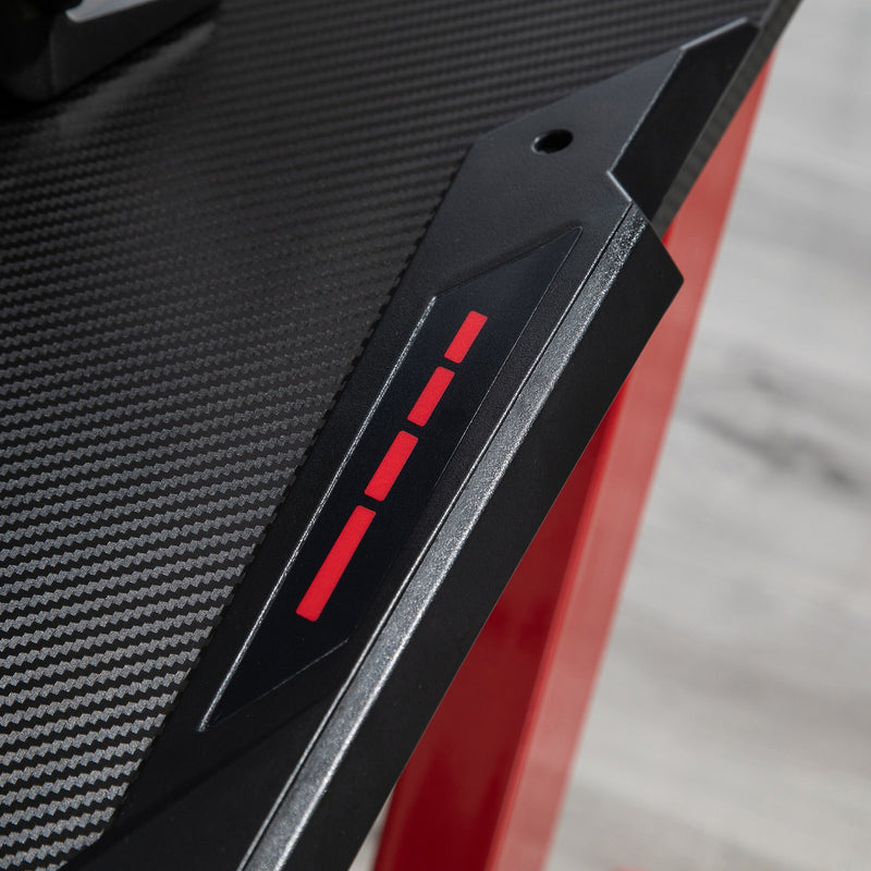 Close-up of the black tabletop corner with red accent detailing