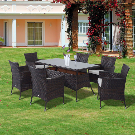 Image of brown rattan 6 seater patio table and chairs dining set with cream cushions