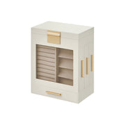 The Dressing Table Jewellery Organiser in white features a transparent front that elegantly displays multiple ring rows on the left and compartments on the right. Its sleek, modern design fits perfectly on any dressing table and includes ample storage along with a convenient drawer at the bottom.
