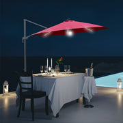 Image of a red cantilever parasol with solar lights
