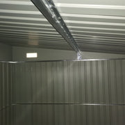 Inside the shed looking up at the roof panels and the galvanised steel support beam
