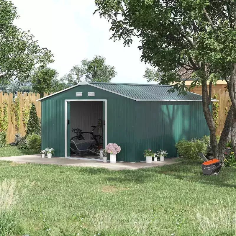 Green metal garden shed on a lawn with the double sliding doors open