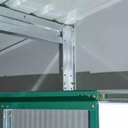 Inside corner of the green shed showing the galvanised steel roof frame and bracing